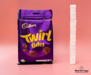 A photo of Cadbury Twirl Bite bag with 15.8 cubes of sugar.