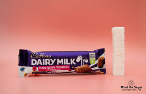 A photo of Cadbury Dairy Milk Marvellous Creations Jelly Candy Bar with 6.8 cubes of sugar.