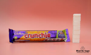 A photo of Cadbury Crunchie bar with 6.5 cubes of sugar.