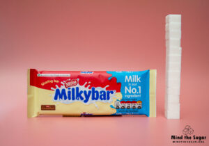 A photo of Milkybar White Chocolate Bar with 13.2 cubes of sugar.