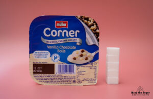 A photo of Muller Corner Vanilla Chocolate Balls Yogurt with 5.2 cubes of sugar.