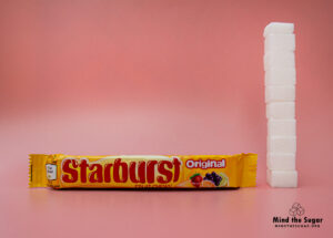 A photo of Starburst Original Fruit Chews bar with 9.4 cubes of sugar.