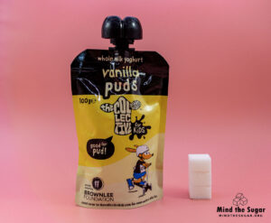 A photo of The Collective Dairy Kids Vanilla Puddings Yogurt with 3 cubes of sugar.