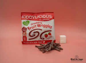 A photo of Kiddylicious Strawberry Fruit Wriggles pack with 2.1 cubes of sugar.